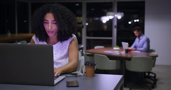 Young office executives working over laptop in a modern office