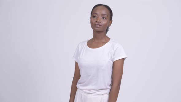 Young Happy African Woman Waiting and Waving Hand