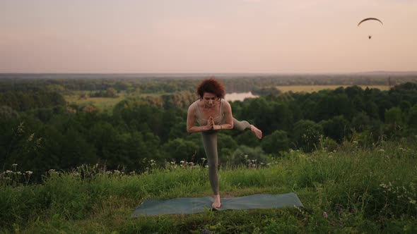 Pretty Girl Doing Yoga and Pilates in the Mountain Forest