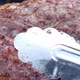 Delicious bubbling meat lifted with a forceps - VideoHive Item for Sale