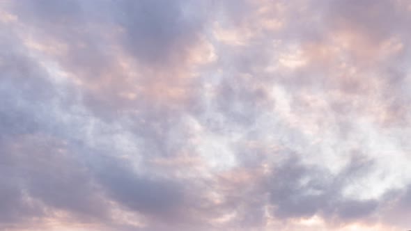 Time lapse with beautiful fast-moving clouds at sunrise	