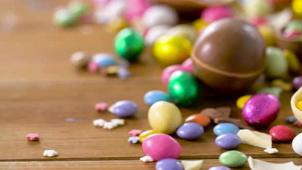 Chocolate Easter Eggs and Drop Candies on Table