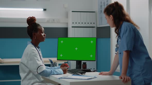 Doctor and Nurse Working with Horizontal Green Screen