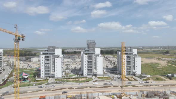 new neighborhood's buildings with cranes at southern district city netivot