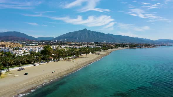 Aerial view of the coastline with beaches and resorts in San Pedro de Alcántara, Malaga, Spain.