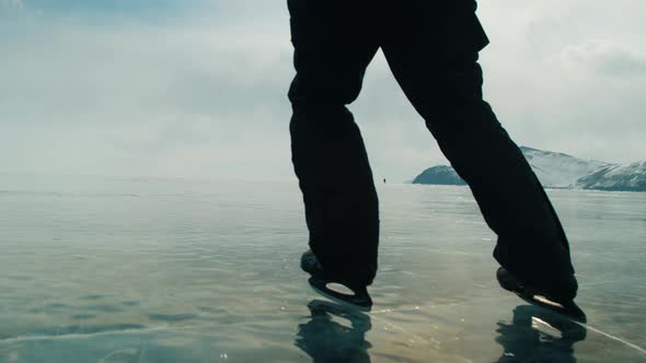 Closeup of Feet of a Speed Skater Riding on the Frozen Lake Baikal