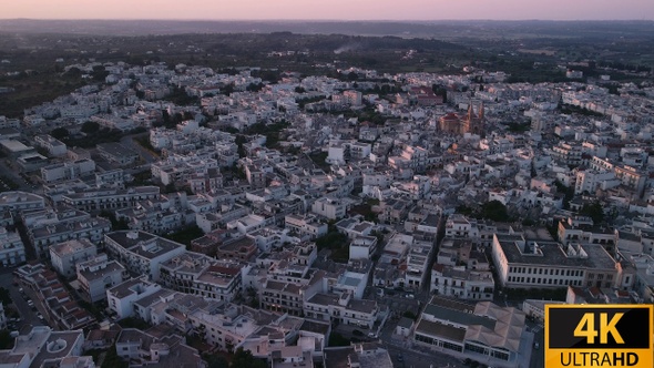 Flying Through Little Town At Sunset