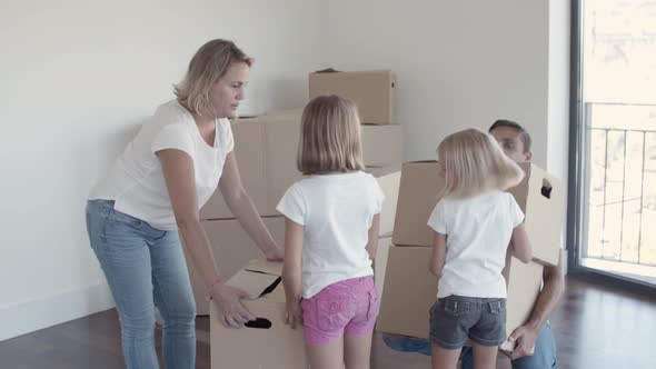 Happy Parents and Daughter Leaving Flat