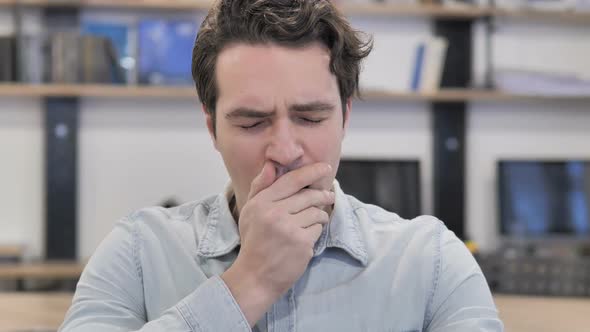 Yawning Tired Creative Man Working in Office