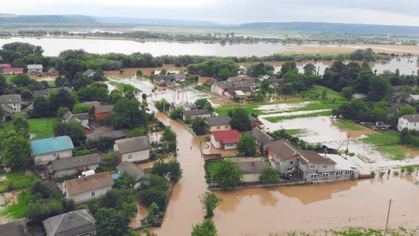 People Who Are in a Flooded House By a River That Overflowed After Rain Floods. Ecological