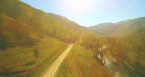 Low Altitude Flight Over Fresh Fast Mountain River with Rocks at Sunny Summer Morning.