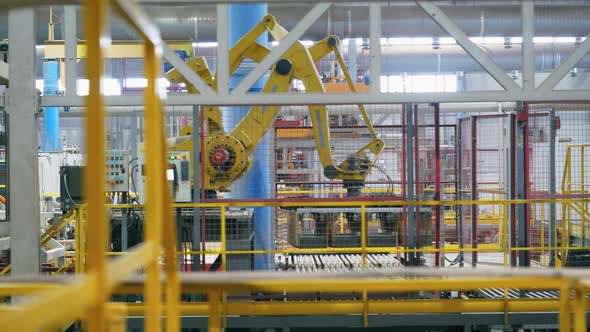 Robotic Machine Moving Bricks on a Line at a Modern Industrial Factory.