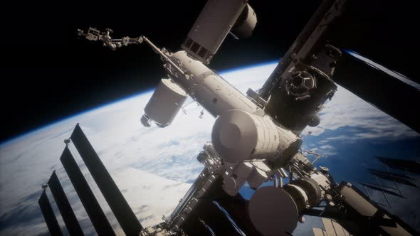 International Space Station in Outer Space Over the Planet Earth alt