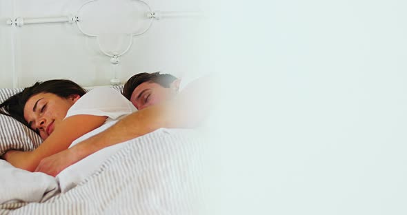 Couple sleeping in bedroom