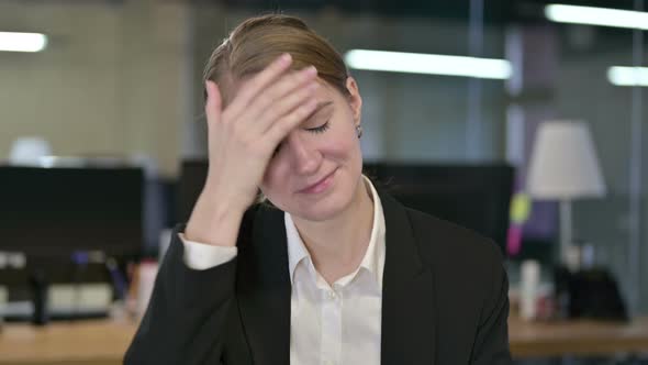 Portrait of Disappointed Young Businesswoman Reacting To Failure