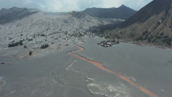 Aerial view of black volcanic sand and crater