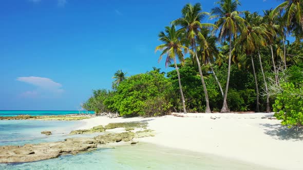 Aerial above panorama of luxury coast beach voyage by blue ocean and white sandy background of journ