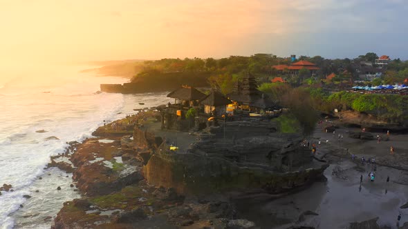 Pura Tanah Lot Temple on the Beach at Sunset in Seaside of Bali Island, Indonesia, Silhouette of a