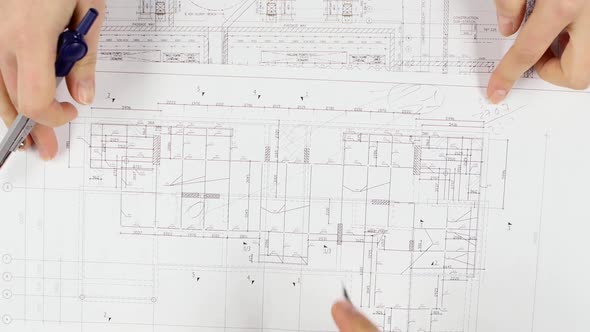 Architect Looks at the Data for the Building's Most Complete Building. Close Up