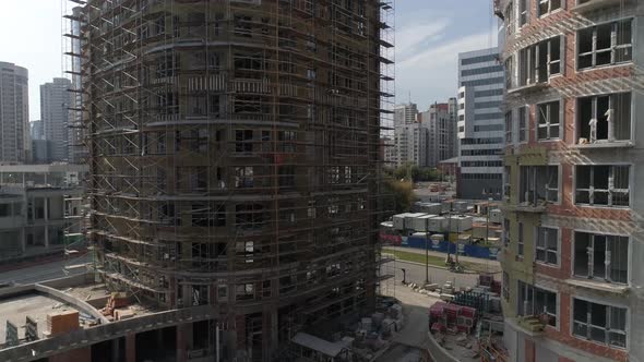 Aerial shot of construction of high-rise apartment buildings in city 23