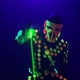Animator Dances with Green Beams on Gloves at Nightclub - VideoHive Item for Sale