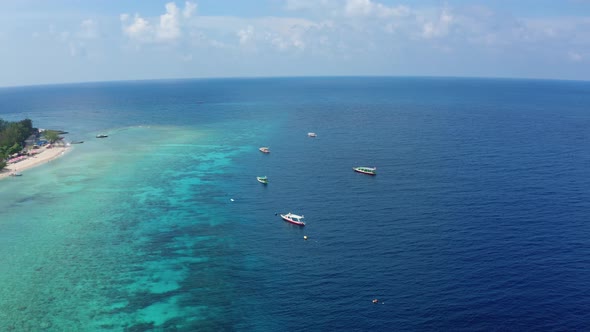 Motion Over Motorboats Sailing at Shelf Zone Against Beach