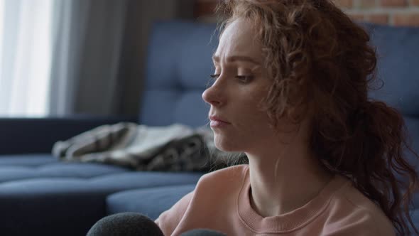 Thoughtful young caucasian woman at home. Shot with RED helium camera in 8K.