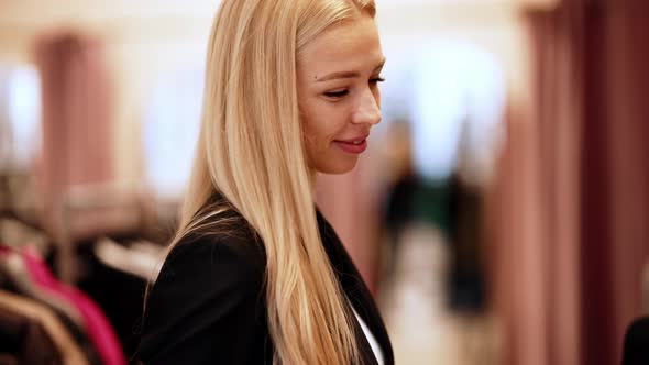 Pretty blonde saleswoman listening a receptionist