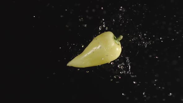 Green Pepper Falls In A Water, Splashing