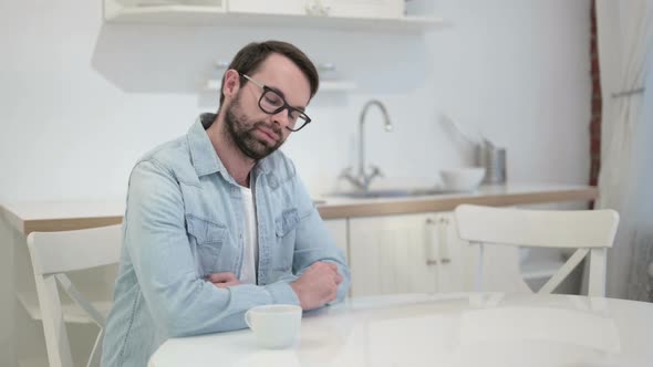 Relaxing Beard Young Man Drinking Coffee in Office