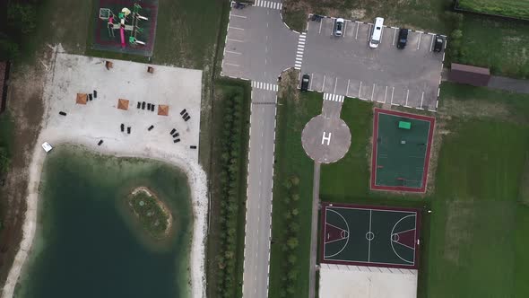 A View From Above at the Cottage Village Recreation Areas Road Parking Lake Sports Grounds Tennis