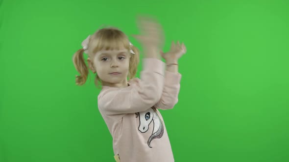 Girl in Unicorn Sweatshirt Dancing. Happy Four Years Old Child. Chroma Key