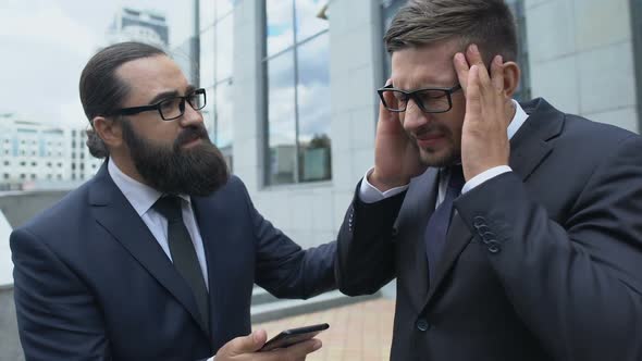 Bearded Man Supporting His Business Colleague With Attack of Terrible Headache