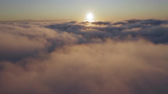 Drone Flying Through Beautiful Cloudscape on Sunrise.  B Roll Footage of Skies