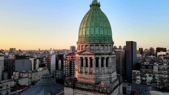 Dome of Argentina's National Congress' at sunset, aerial view, orbit.