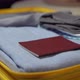 A Young Woman is Packing Her Suitcase - VideoHive Item for Sale