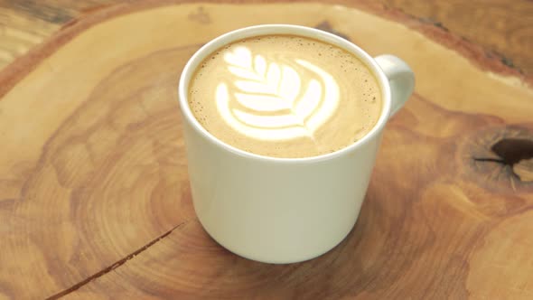 Latte Cup with Flower Art.