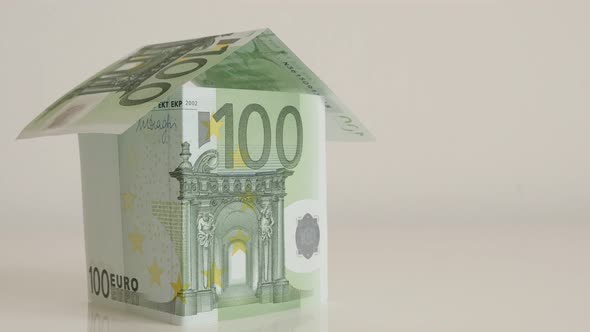 Concept of real estate building with EU paper money 4K 2160p 30fps UltraHD  tilting   footage - Clos