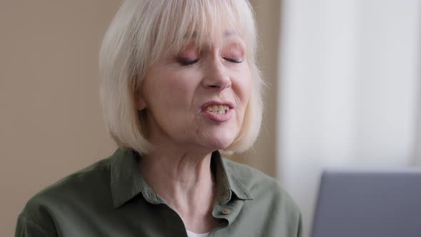 Portrait Old Senior Caucasian Woman Grandmother Talking to Web Cam with Grandchildren