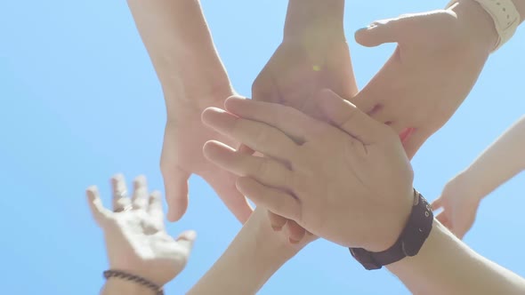 Bottom View Group of Young People Joining Their Palms Together