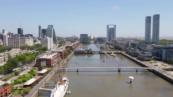 Aerial establishing shot flying over Puerto Madero docks in Buenos Aires city