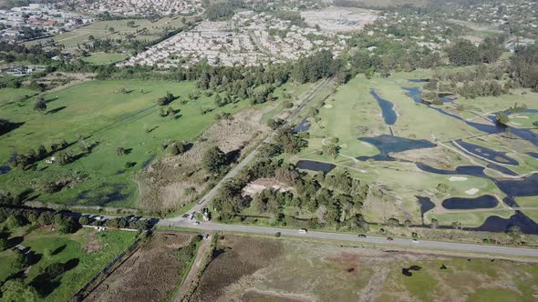 Knysna Golf Course and green treed suburbs, South Africa Cape aerial