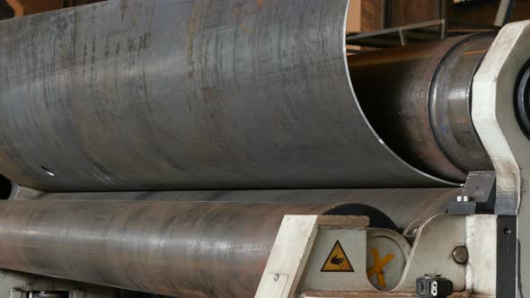 Metal Sheet in Rolling Machine. View of Machine Rolling Metal Sheet in Process on Modern Manufacture