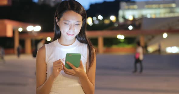 Woman use of cellphone at night 