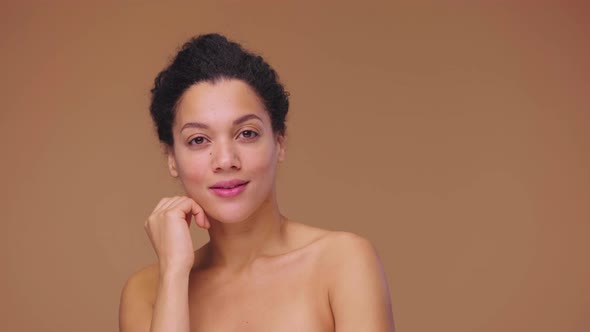 Beauty Portrait of Young African American Woman She Gently Touches Face with Her Fingers