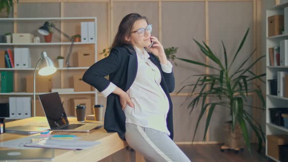 Happy Attractive Office Worker a Pregnant Woman Wearing Glasses Workplace