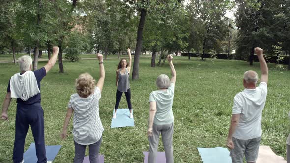 Seniors Stretching Arms