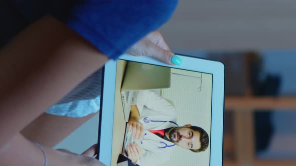 Vertical Video: Patient Having Video Conference with Doctor
