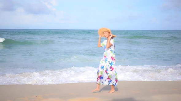 Asian woman enjoy around beautiful beach sea ocean