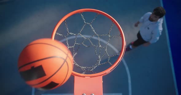 Men Play Basketball Throwing Ball Into Basket Upper View